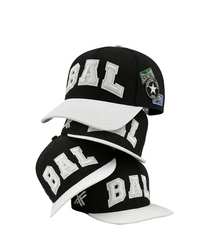 Black and white baseball caps with 'BAL' branding on a light gray background